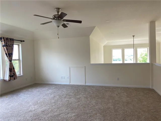 a view of staircase with a hallway