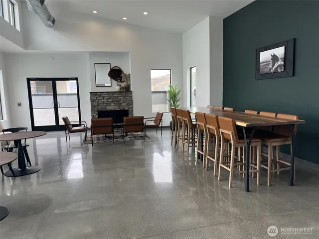 a dining room with furniture window and wooden floor