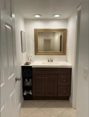 a bedroom with a bed and a night stand