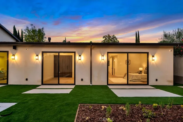 a view of a back yard with an outdoor space