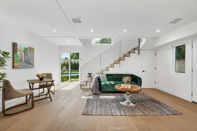 a living room with furniture and a rug