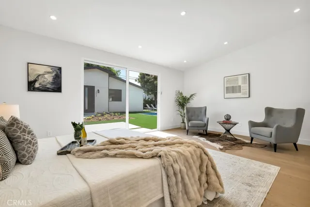 a bedroom with a bed and furniture