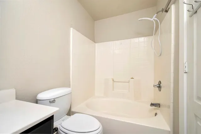 a large kitchen with kitchen island a sink stainless steel appliances and cabinets