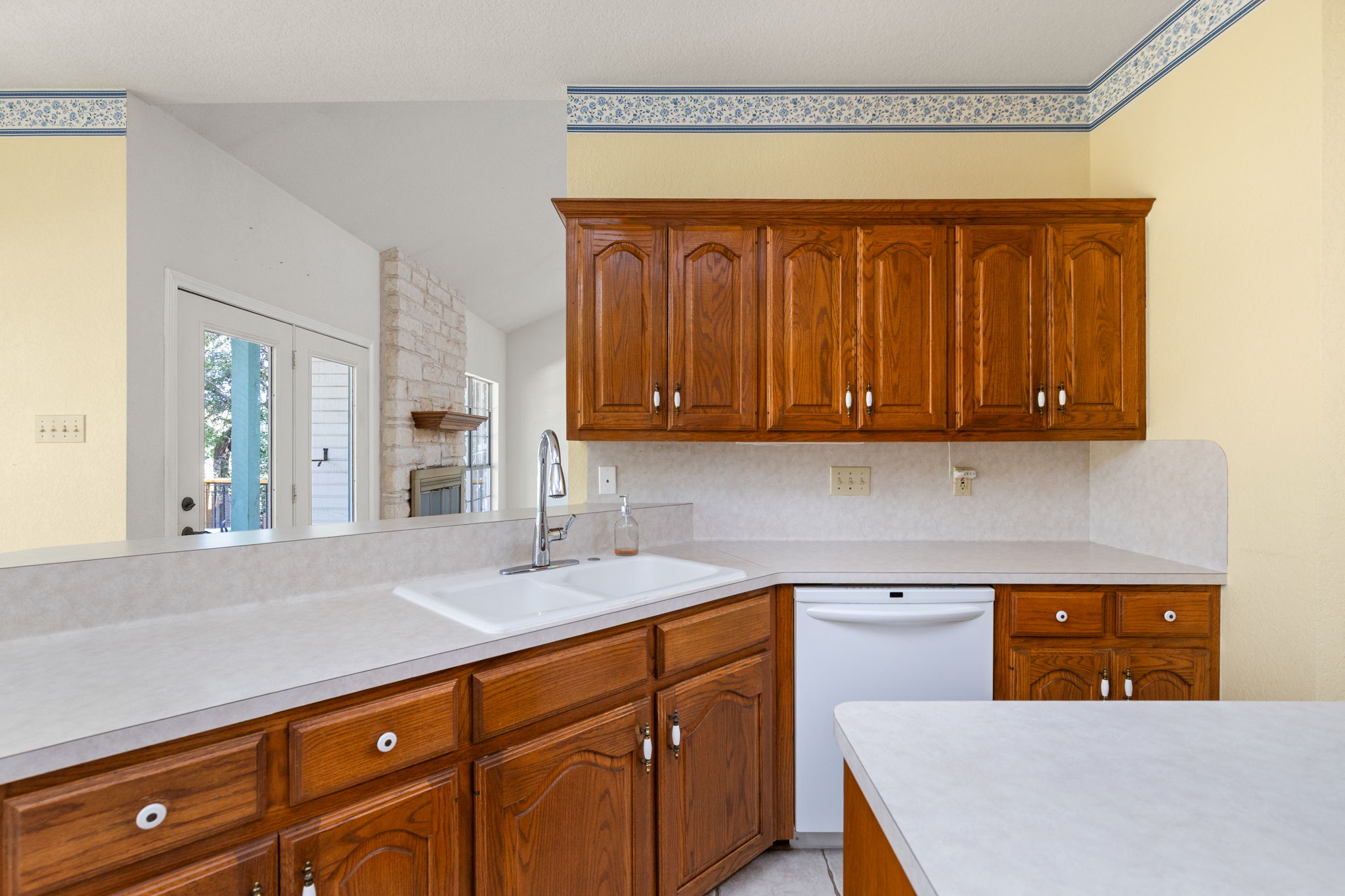 134 Canyon Road Georgetown, TX 78628 - Photo 14 of 40 Rich wood cabinetry paired with light countertops defines this functional culinary space.