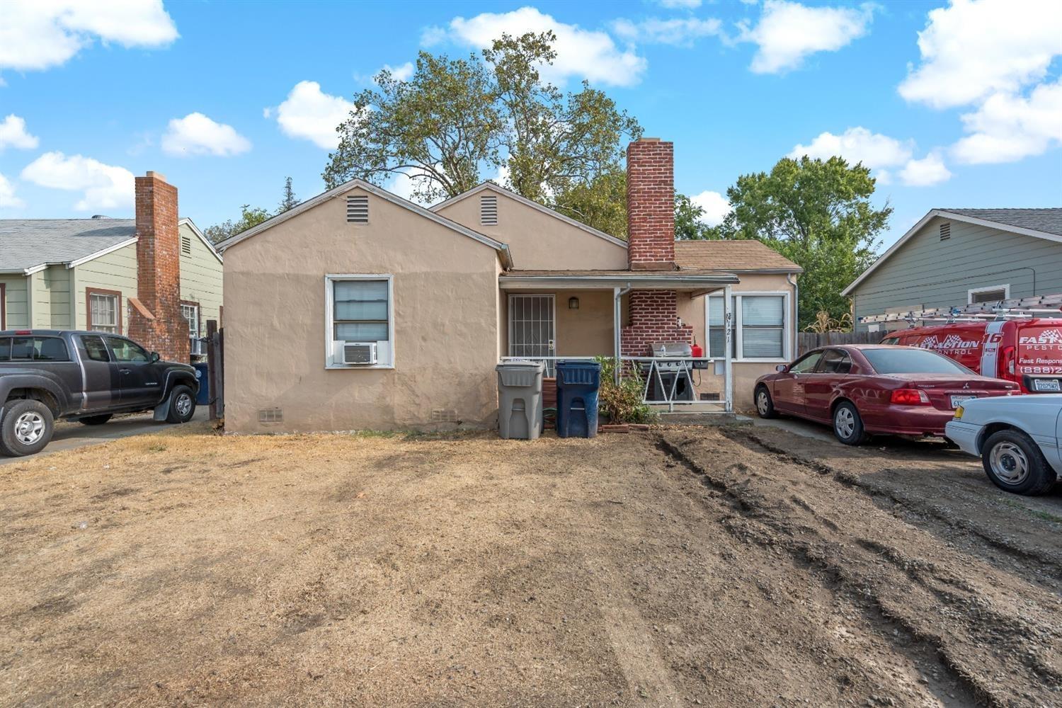 2121 Marconi Avenue Sacramento, CA 95821 - Photo 1 of 2 a view of a car park in front of house