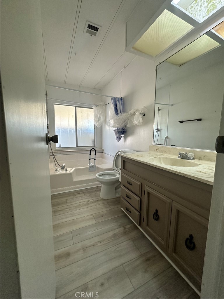881 North Lake Street, Unit 301 Hemet, CA 92544 - Photo 11 of 21 a bathroom with double vanity and a mirror