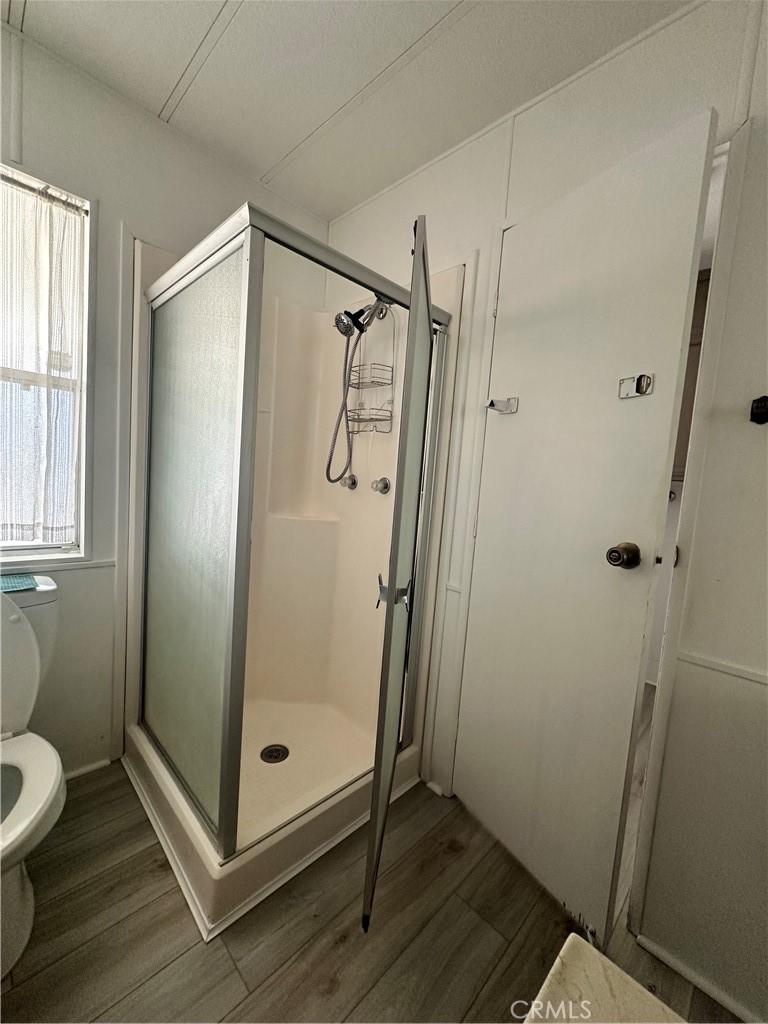 881 North Lake Street, Unit 301 Hemet, CA 92544 - Photo 16 of 21 a bathroom with a shower and a toilet