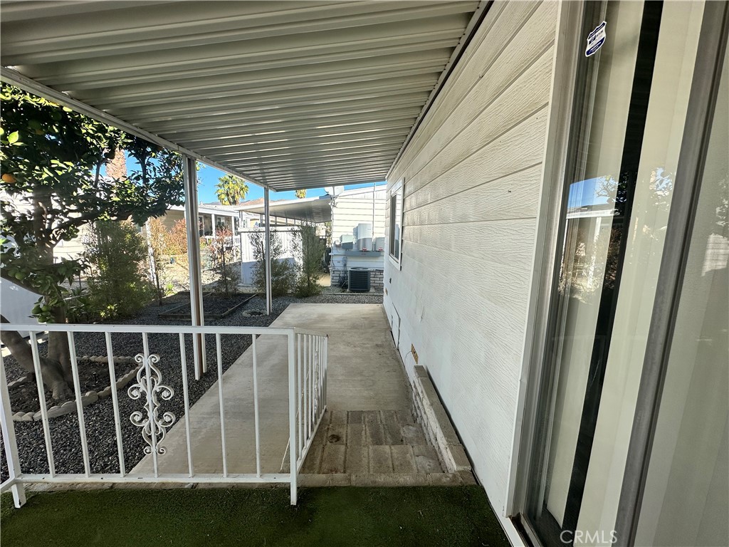 881 North Lake Street, Unit 301 Hemet, CA 92544 - Photo 21 of 21 a view of balcony with wooden floor and fence