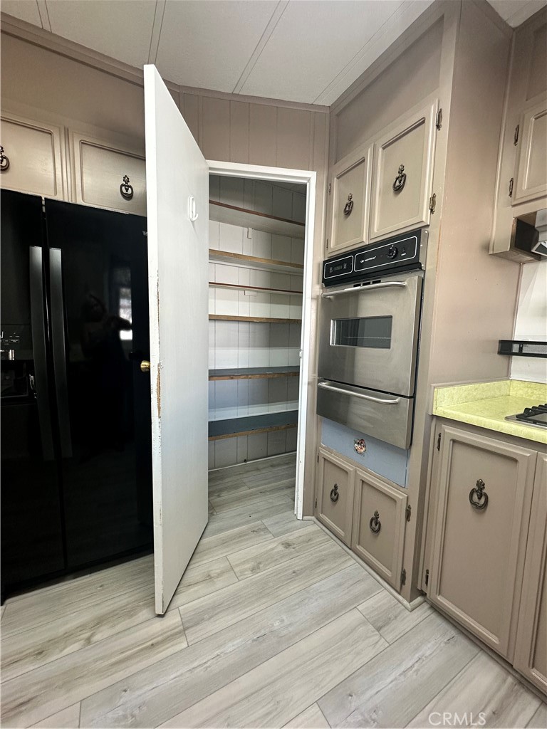 881 North Lake Street, Unit 301 Hemet, CA 92544 - Photo 7 of 21 a kitchen with a refrigerator and a stove