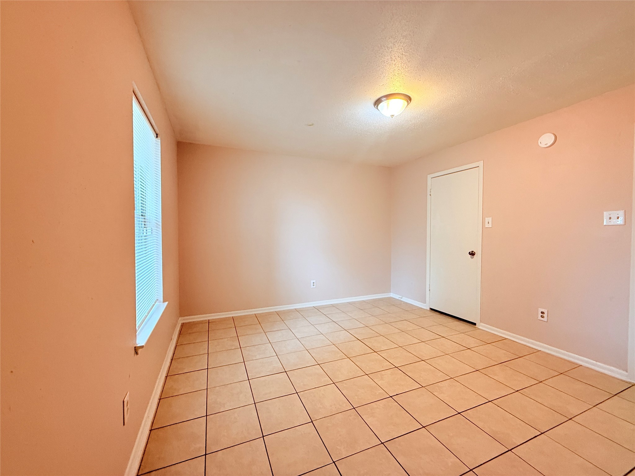 208 Laurie Lane Willis, TX 77378 - Photo 19 of 35 a view of an empty room and window