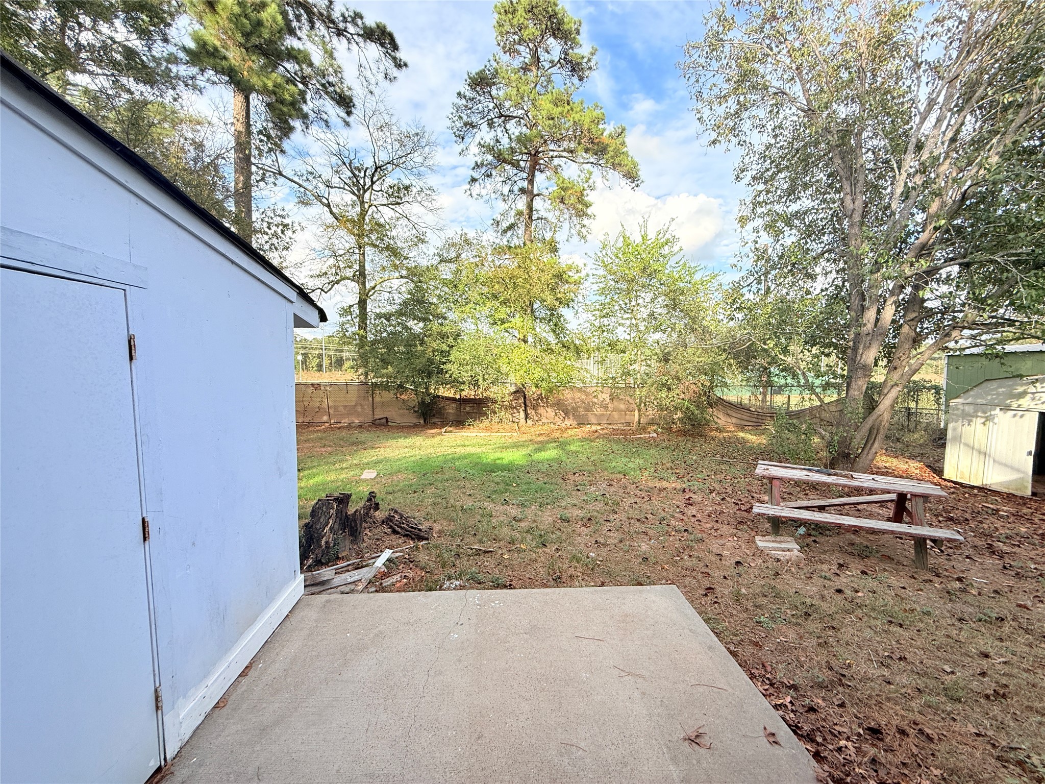 208 Laurie Lane Willis, TX 77378 - Photo 34 of 35 a view of a yard with plants and trees