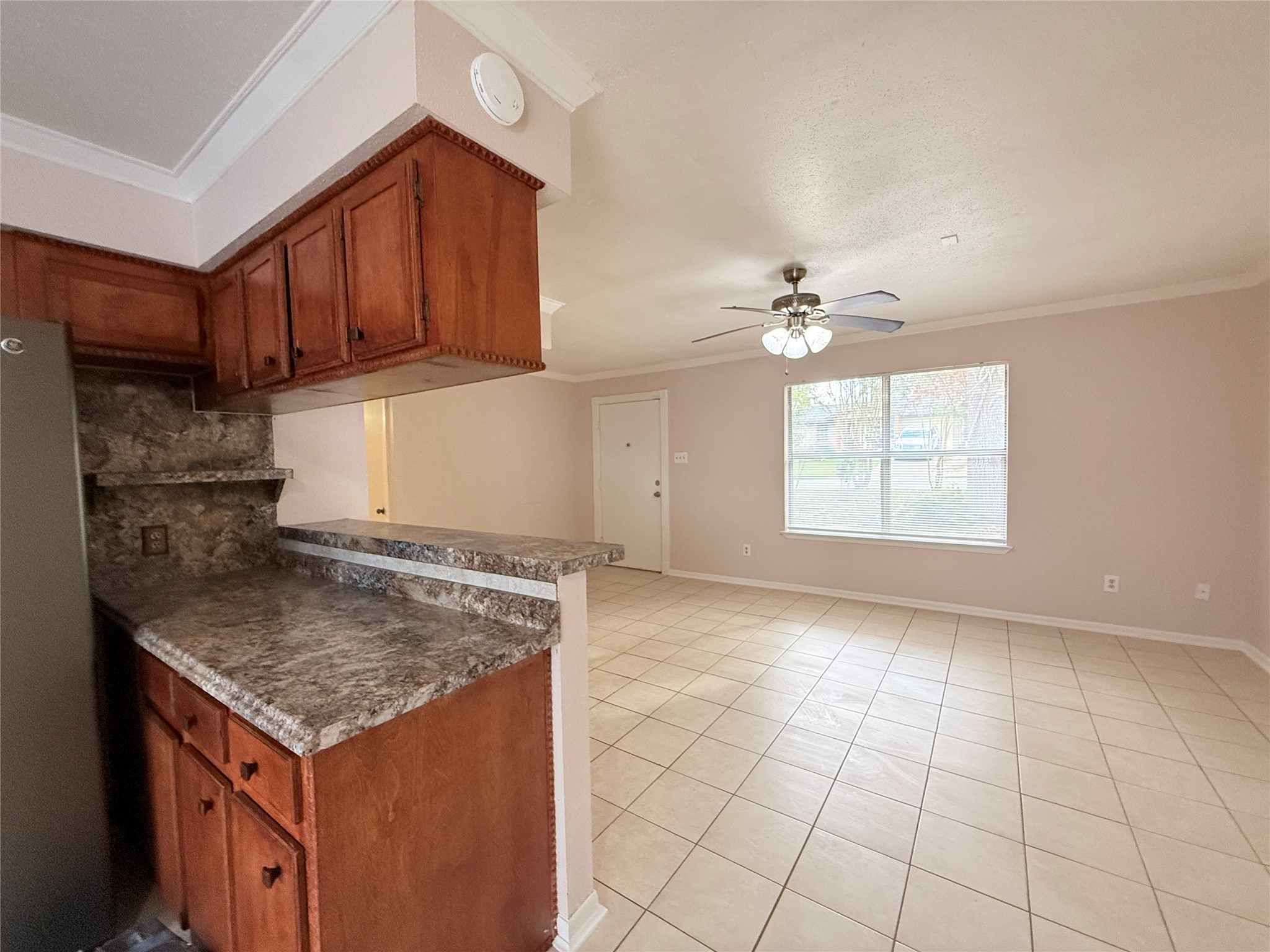 208 Laurie Lane Willis, TX 77378 - Photo 8 of 35 an empty room with windows and cabinet