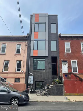 a front view of a building with many windows