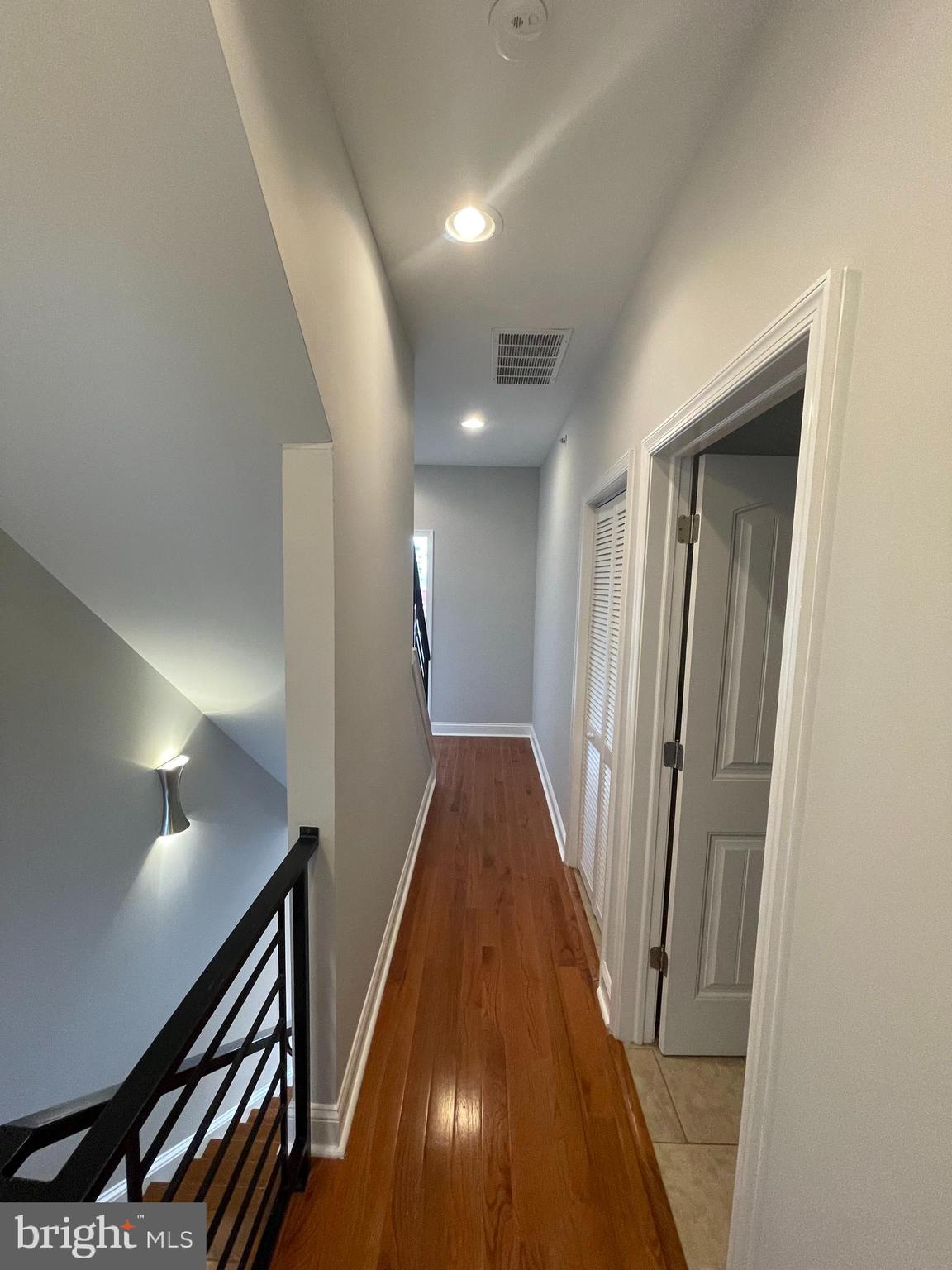 2510 Federal Street, Unit 2 Philadelphia, PA 19146 - Photo 15 of 22 a view of a hallway with wooden floor
