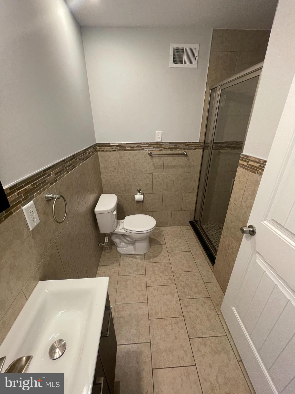2510 Federal Street, Unit 2 Philadelphia, PA 19146 - Photo 10 of 22 a bathroom with a sink and a vanity