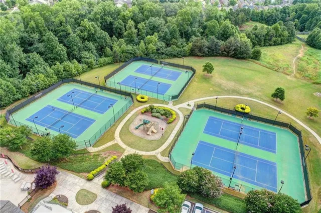 a view of a swimming pool with a yard