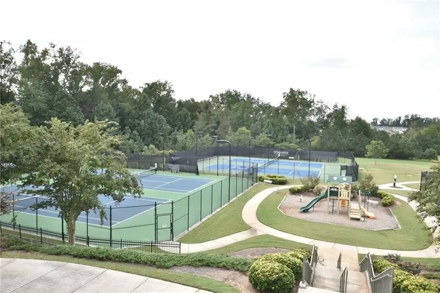 a view of a swimming pool with chairs