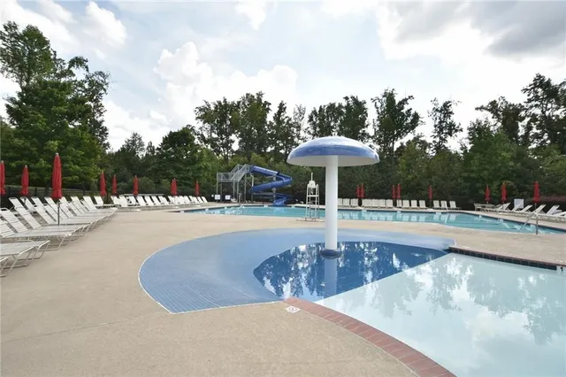 a view of swimming pool with outdoor seating