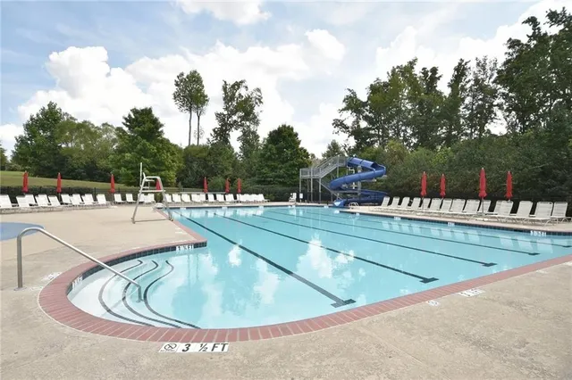 a view of a swimming pool with a lounge chairs