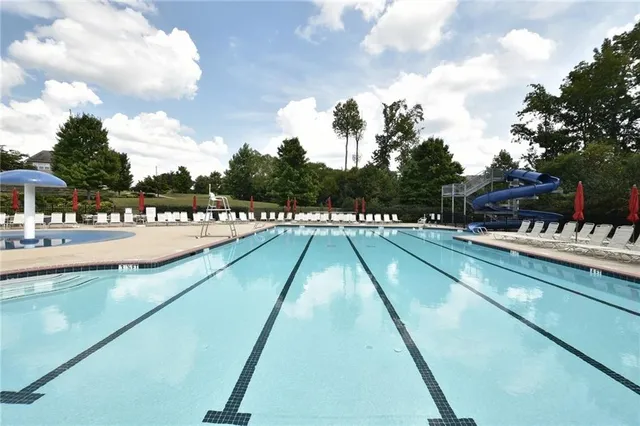 a view of swimming pool with outdoor seating