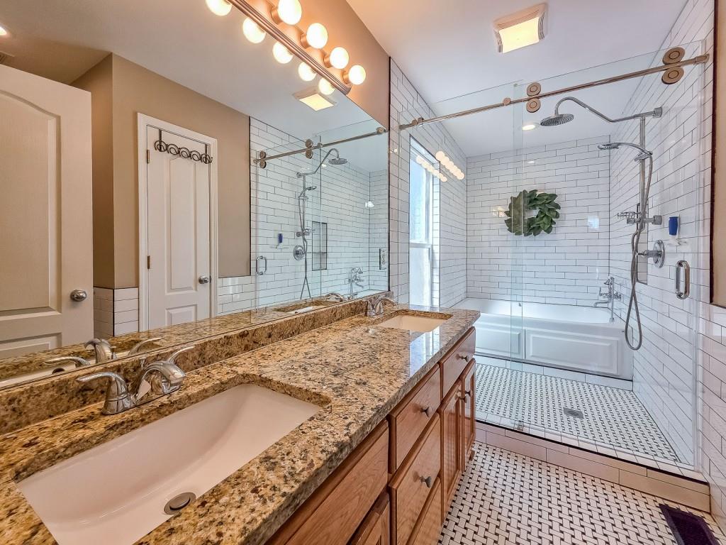165 Horseshoe Bend Jasper, GA 30143 - Photo 20 of 44 a bathroom with a granite countertop sink and a shower
