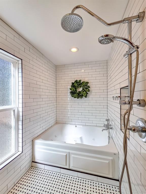 165 Horseshoe Bend Jasper, GA 30143 - Photo 21 of 44 a bathroom with a bathtub and a shower