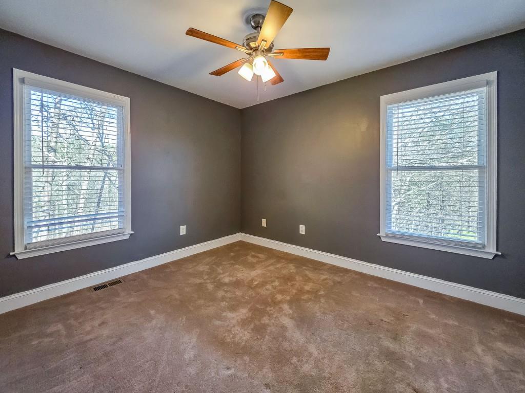 165 Horseshoe Bend Jasper, GA 30143 - Photo 25 of 44 a view of a livingroom with a ceiling fan and a window