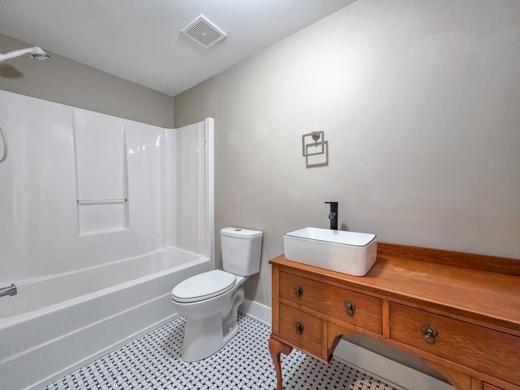 165 Horseshoe Bend Jasper, GA 30143 - Photo 28 of 44 a bathroom with a sink a toilet and shower