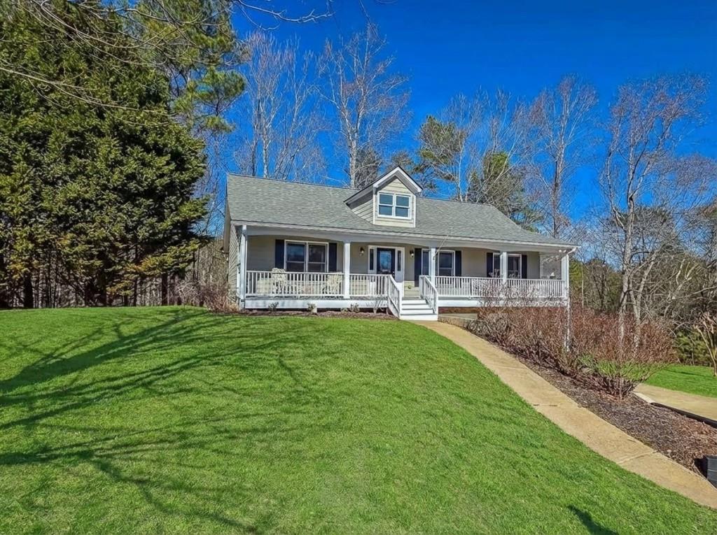 165 Horseshoe Bend Jasper, GA 30143 - Photo 3 of 44 a front view of a house with garden