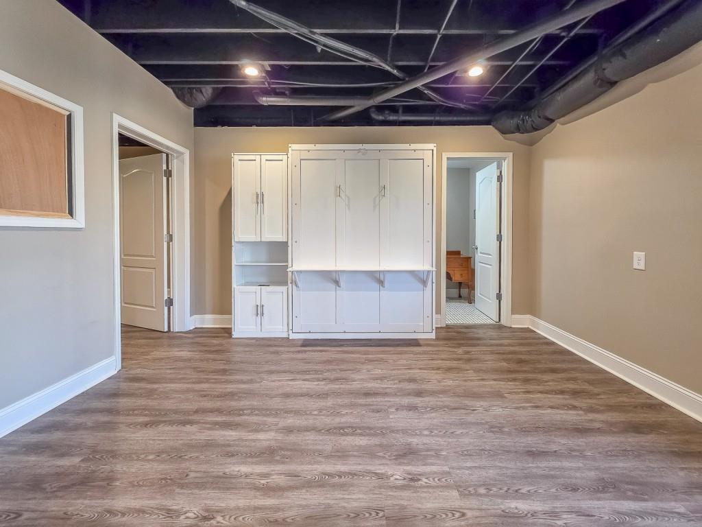 165 Horseshoe Bend Jasper, GA 30143 - Photo 31 of 44 a view of empty room with wooden floor and windows