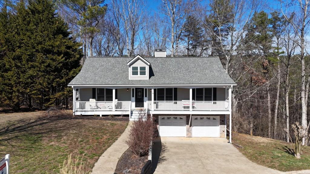 165 Horseshoe Bend Jasper, GA 30143 - Photo 37 of 44 a front view of a house with a yard table and chairs