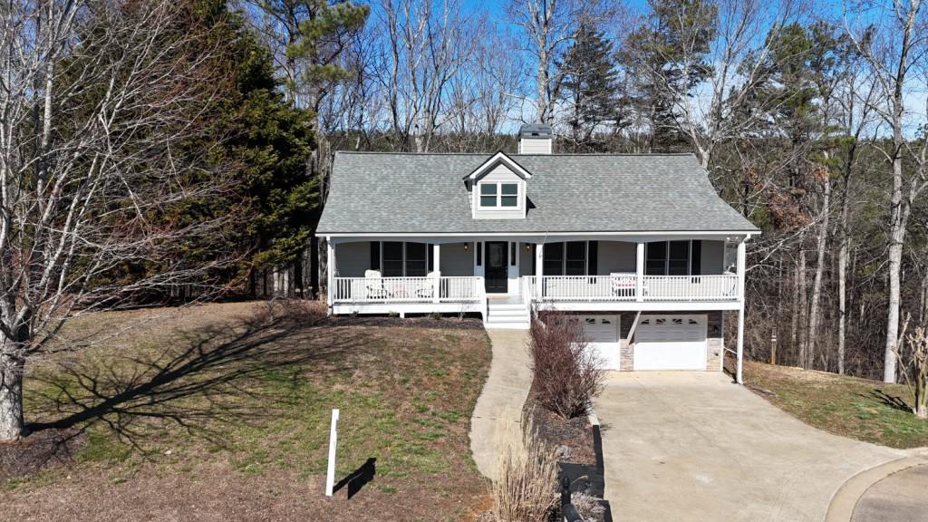 165 Horseshoe Bend Jasper, GA 30143 - Photo 40 of 44 a front view of a house with a yard table and chairs