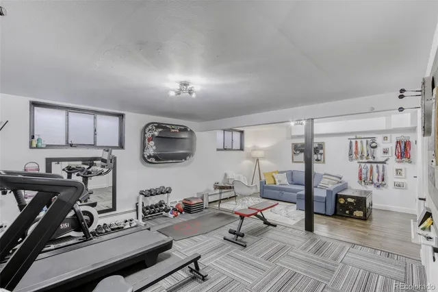 a view of a livingroom with workspace and a couch