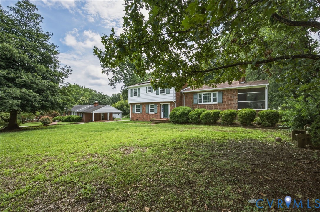 4021 Beulah Road Richmond, VA 23237 - Photo 3 of 27 Brick and white siding exterior with green shutter