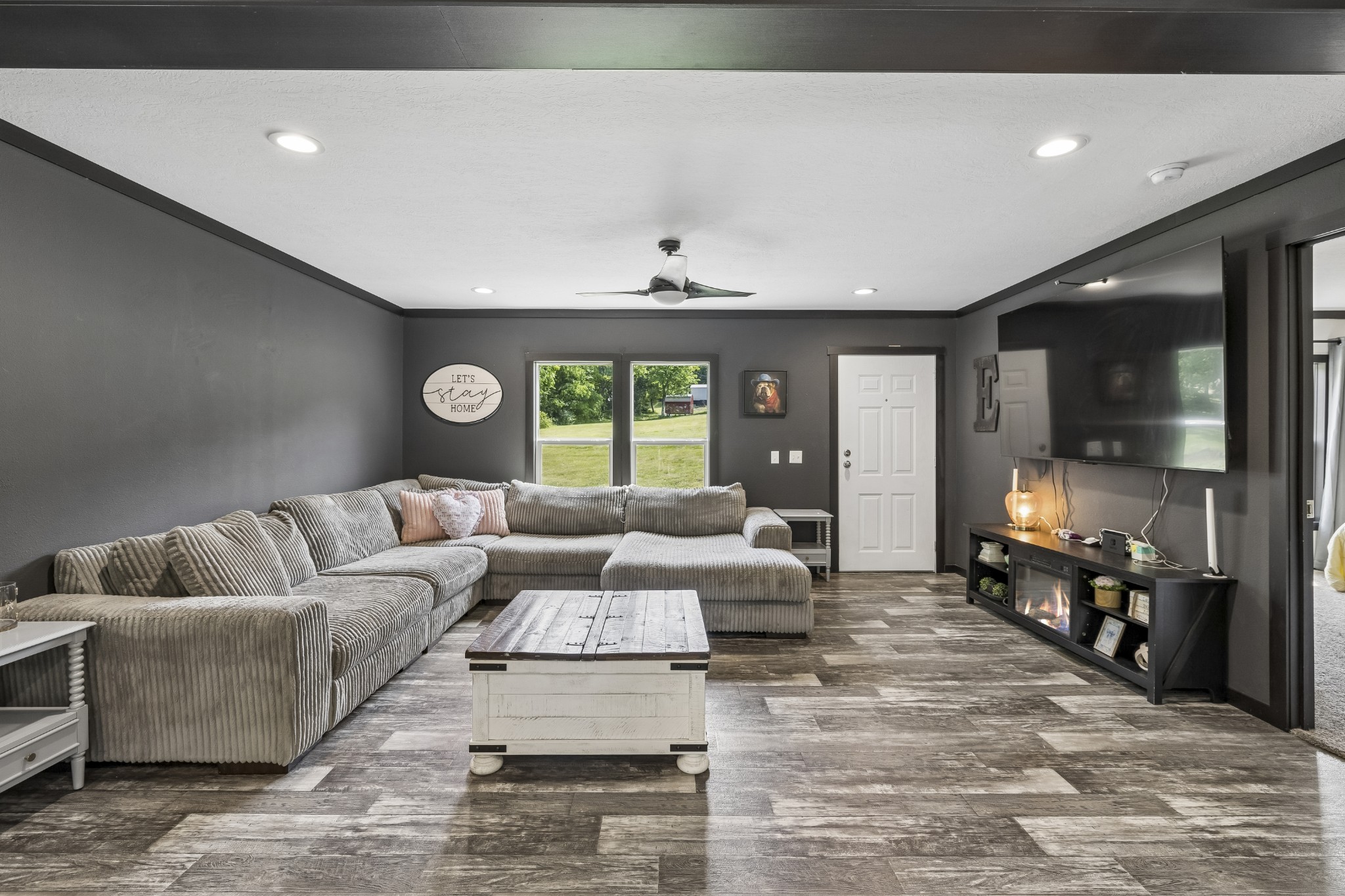8079 Golf Club Road Mount Pleasant, TN 38474 - Photo 13 of 74 a living room with couches and kitchen view with wooden floor