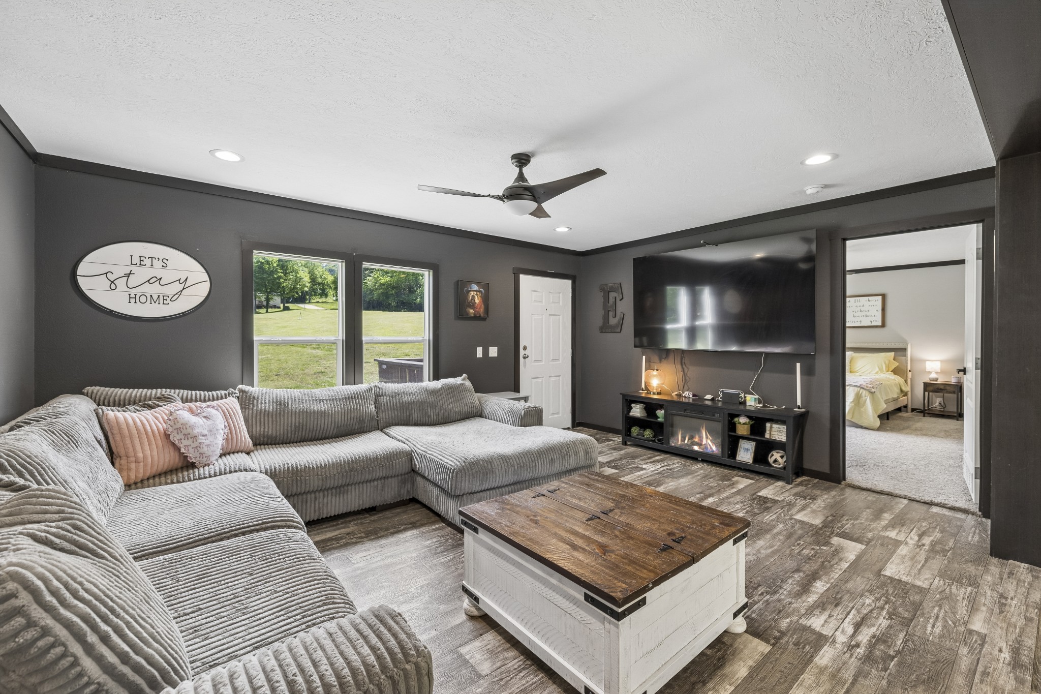 8079 Golf Club Road Mount Pleasant, TN 38474 - Photo 14 of 74 a living room with furniture and a flat screen tv