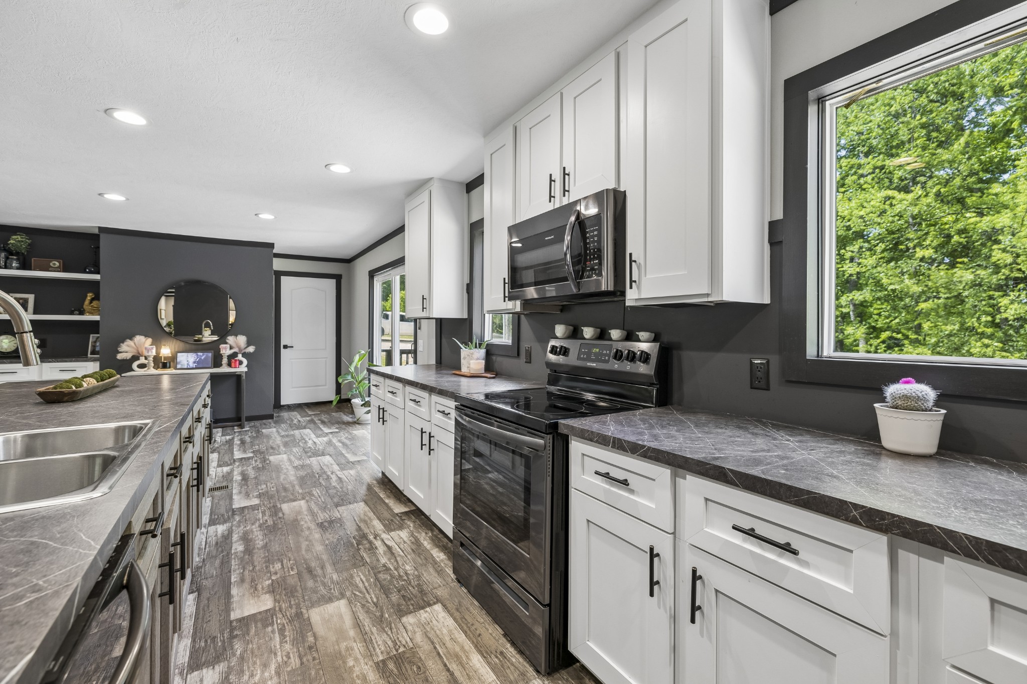 8079 Golf Club Road Mount Pleasant, TN 38474 - Photo 26 of 74 a kitchen with granite countertop a sink a counter space appliances and cabinets