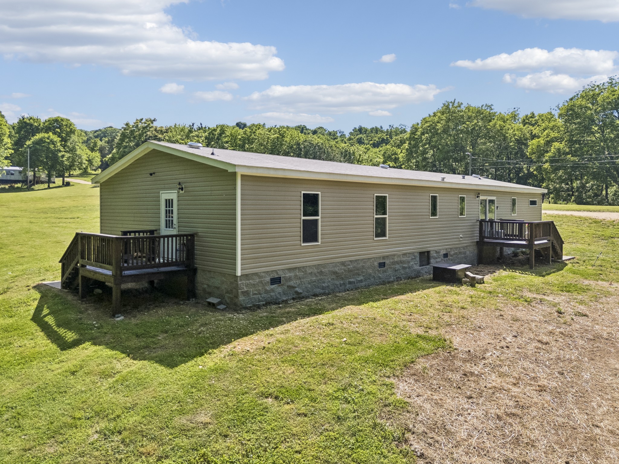 8079 Golf Club Road Mount Pleasant, TN 38474 - Photo 65 of 74 a view of a house with a backyard