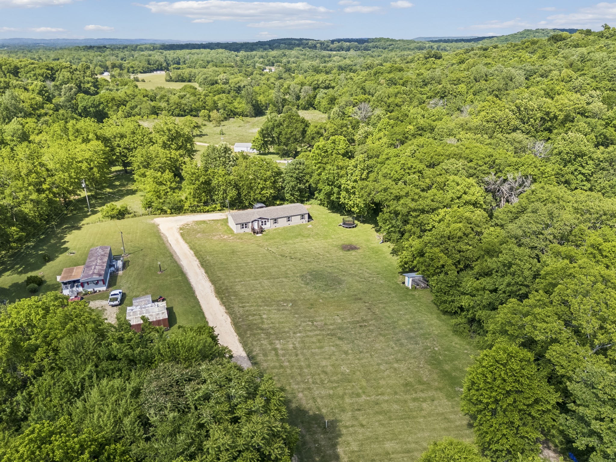 8079 Golf Club Road Mount Pleasant, TN 38474 - Photo 67 of 74 a view of a big yard with an outdoor space
