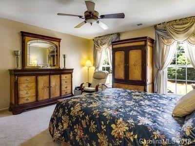 7017 Meyer Road Fort Mill, SC 29715 - Photo 12 of 26 a bedroom with a bed dresser and a window