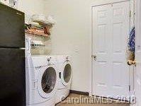 7017 Meyer Road Fort Mill, SC 29715 - Photo 16 of 26 a close view of a utility room with dryer and washer