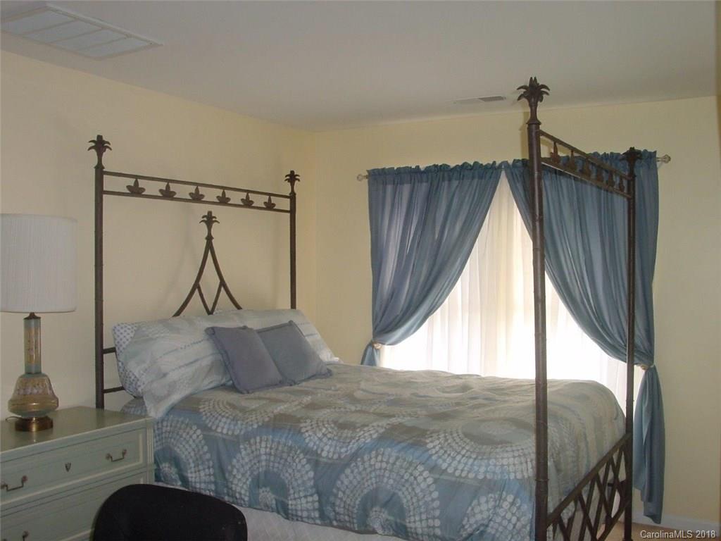 7017 Meyer Road Fort Mill, SC 29715 - Photo 21 of 26 a bedroom with a bed window and a balcony
