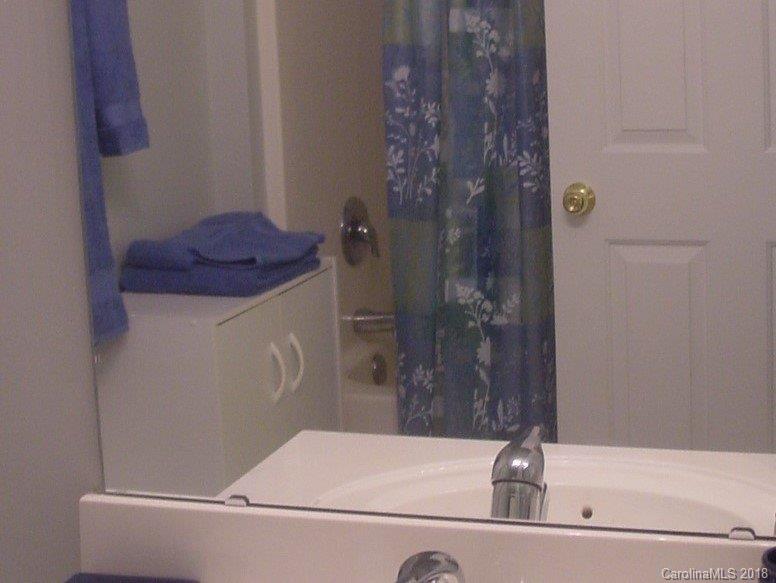 7017 Meyer Road Fort Mill, SC 29715 - Photo 23 of 26 a bathroom with a bathtub and shower