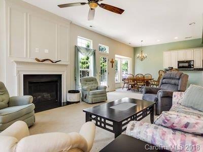 7017 Meyer Road Fort Mill, SC 29715 - Photo 5 of 26 a living room with furniture fireplace and a table