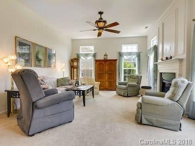 7017 Meyer Road Fort Mill, SC 29715 - Photo 6 of 26 a living room with furniture fireplace and a large window