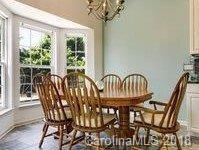 7017 Meyer Road Fort Mill, SC 29715 - Photo 7 of 26 a view of a dining room with furniture window and outside view