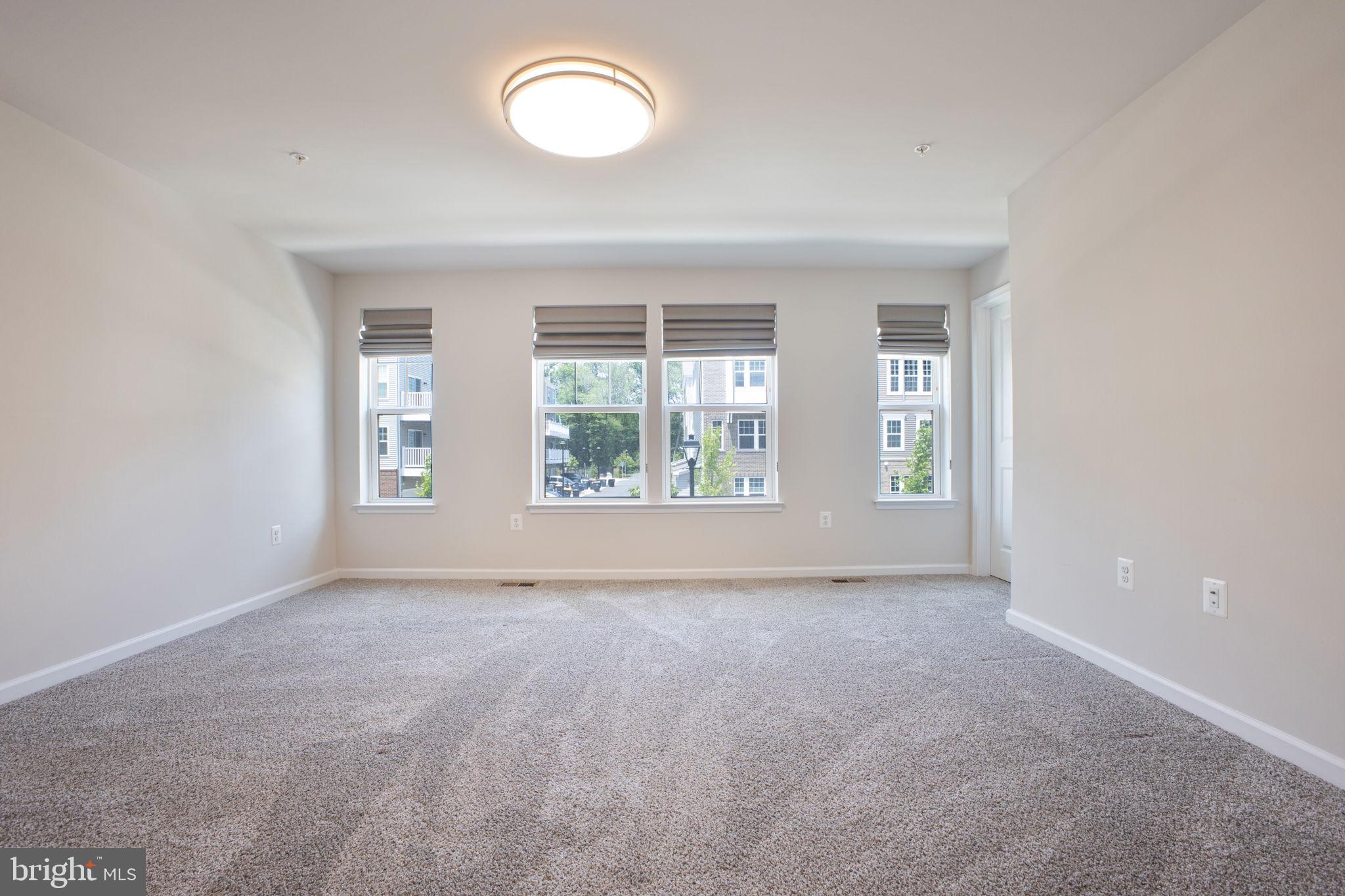 10517 Sally Ride Lane Lanham, MD 20706 - Photo 13 of 37 an empty room with windows
