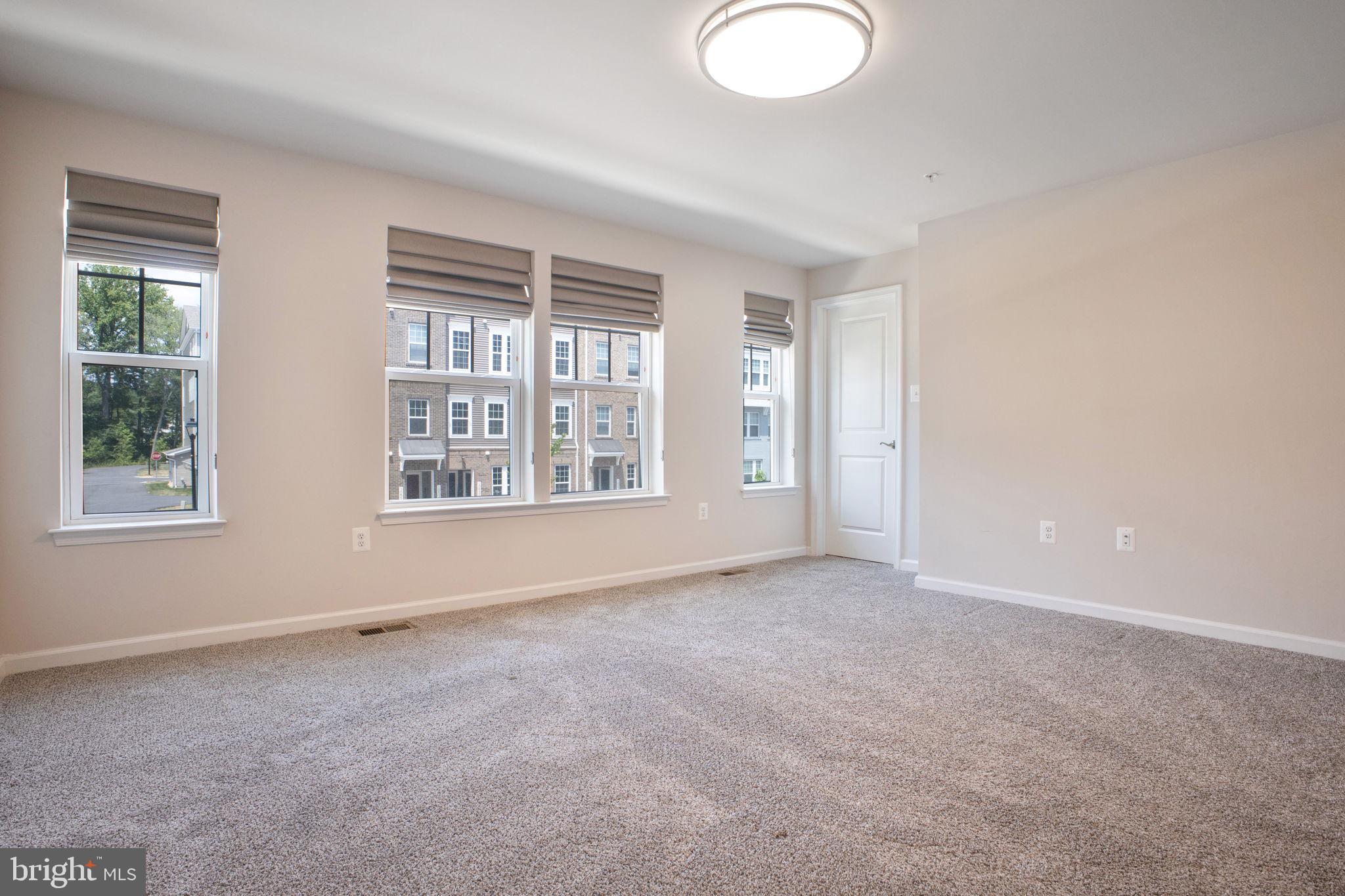 10517 Sally Ride Lane Lanham, MD 20706 - Photo 14 of 37 an empty room with windows