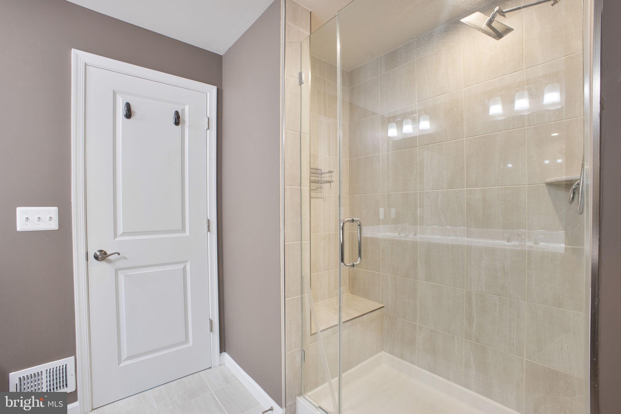 10517 Sally Ride Lane Lanham, MD 20706 - Photo 21 of 37 a bathroom with a shower
