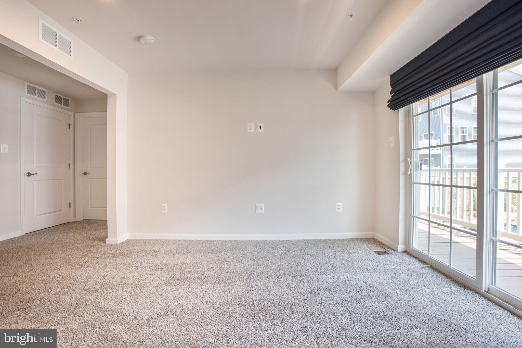 10517 Sally Ride Lane Lanham, MD 20706 - Photo 23 of 37 a view of an empty room with a window